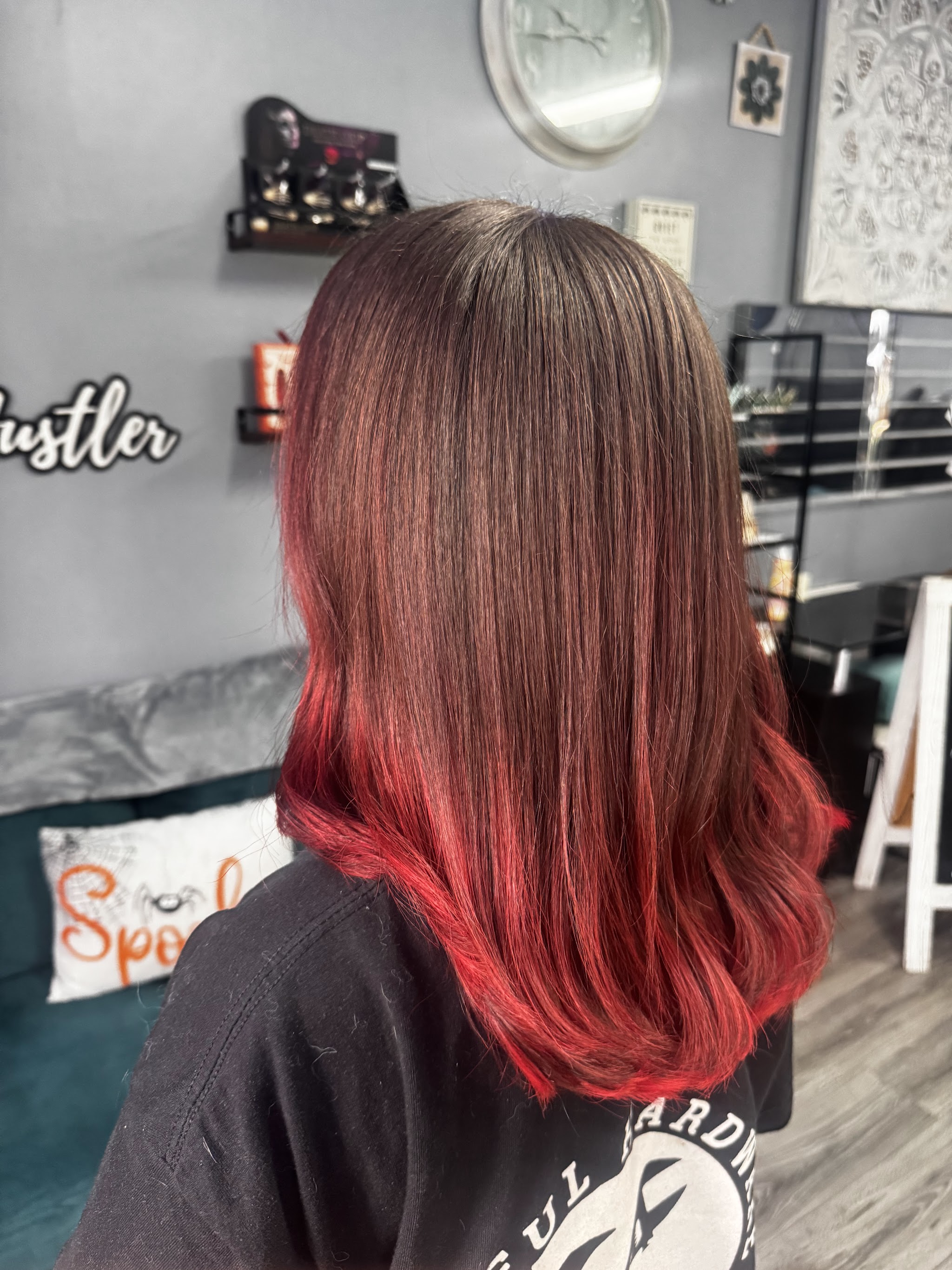 Brunette hair fading into bright red ends